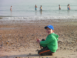 beach at southsea swimming in the sea in March at low tide