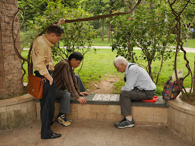 two men playing xiangqi at he Lin Zexu Memorial Park in Guangzhou