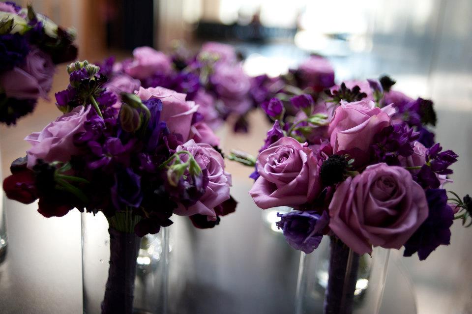 We did petite bouquets for the bridesmaids featuring soft purple roses 