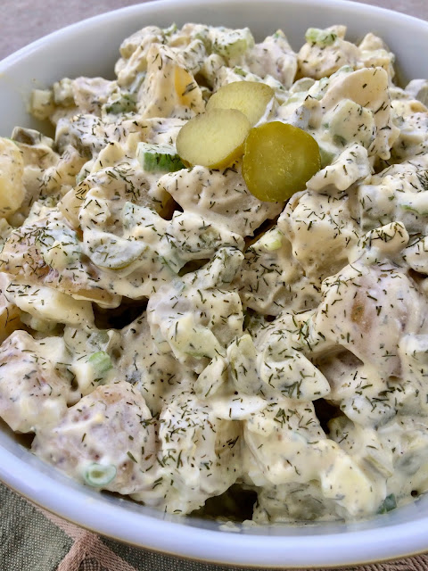 Close-up of finished bowl of dill pickle potato salad.