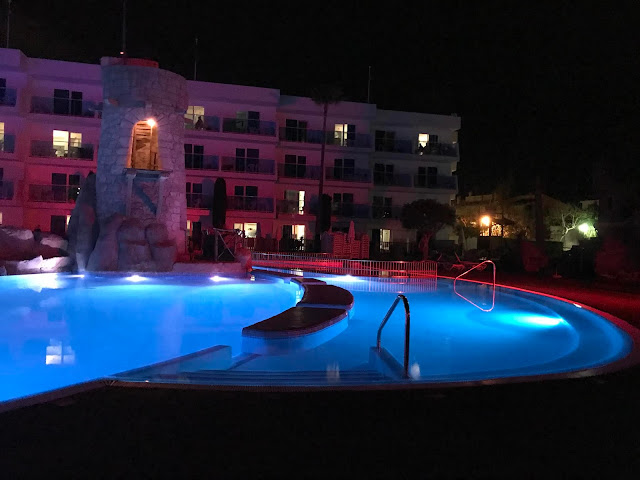 the pool at pirates village lit up in dark