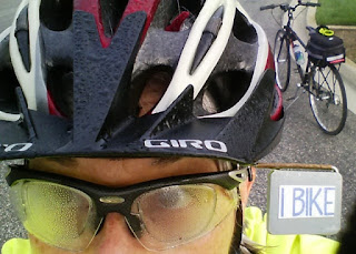 Fog condensed on helmet and glasses, bike in background.