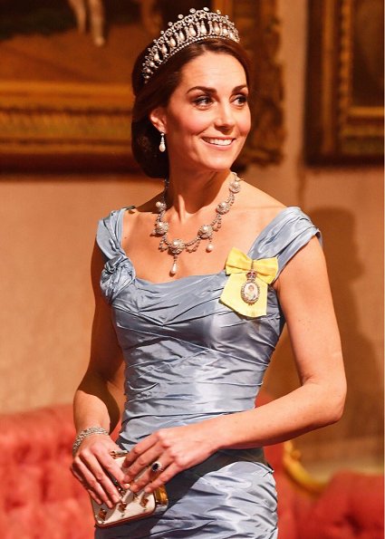 Kate Middleton's wearing the Lovers Knot Tiara, Diana's Collingwood earrings and blue McQueen gown. Maxima' Jan Taminiau gown and pearl tiara