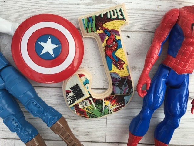 Wooden letter with a Marvel fabric front and Spider-Man and Captain America toys either side