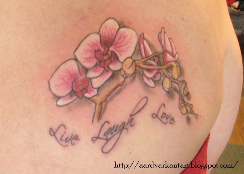 orchid flower tattoo title=