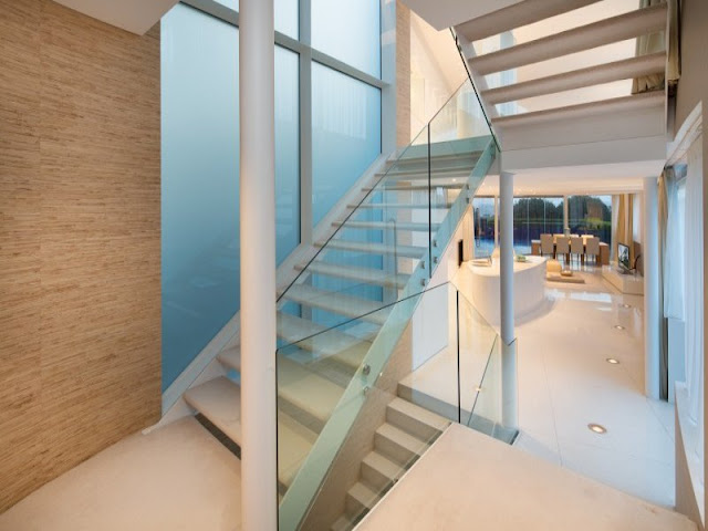 Modern staircase with glass railing 