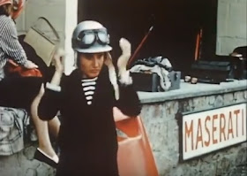 De Filippis prepares to take the wheel outside the Maserati garage during the 1958 season