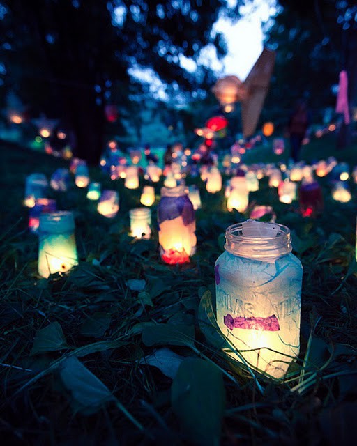 These mason jar lanterns remind me of a field of fairies