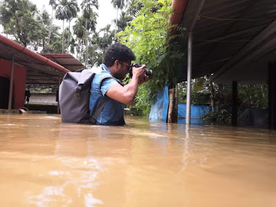 Albin Mathew Photojournalist taking photos during Kerala floods.