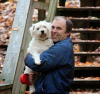 Me holding Suki in the forest in Michigan among the fall color.