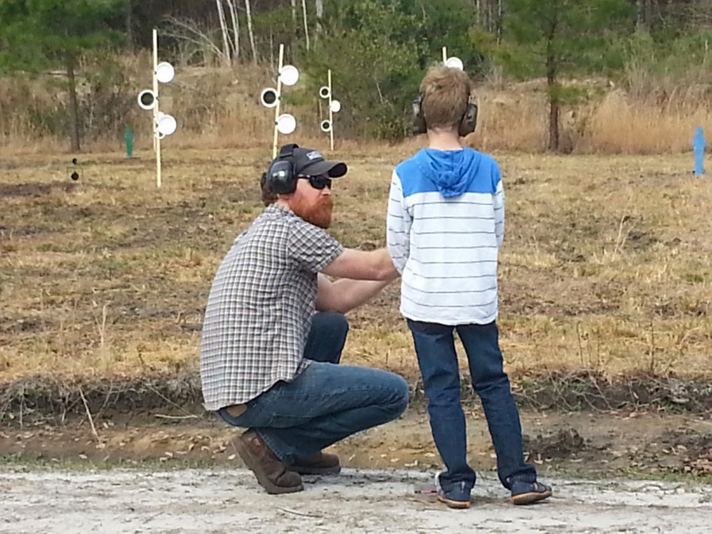 Kid shooting pistol