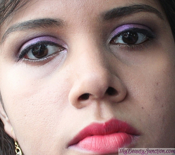 Party look with purple eye makeup and red lips