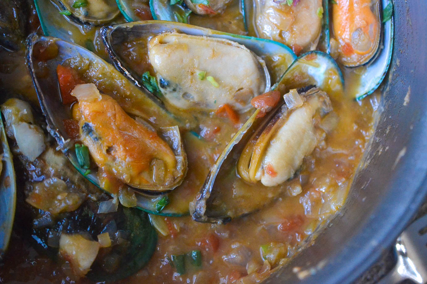 Greedy Girl Steamed mussels in a garlic tomato wine sauce