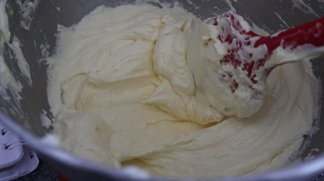 Lemon buttercream in the bowl of the kitchen aid
