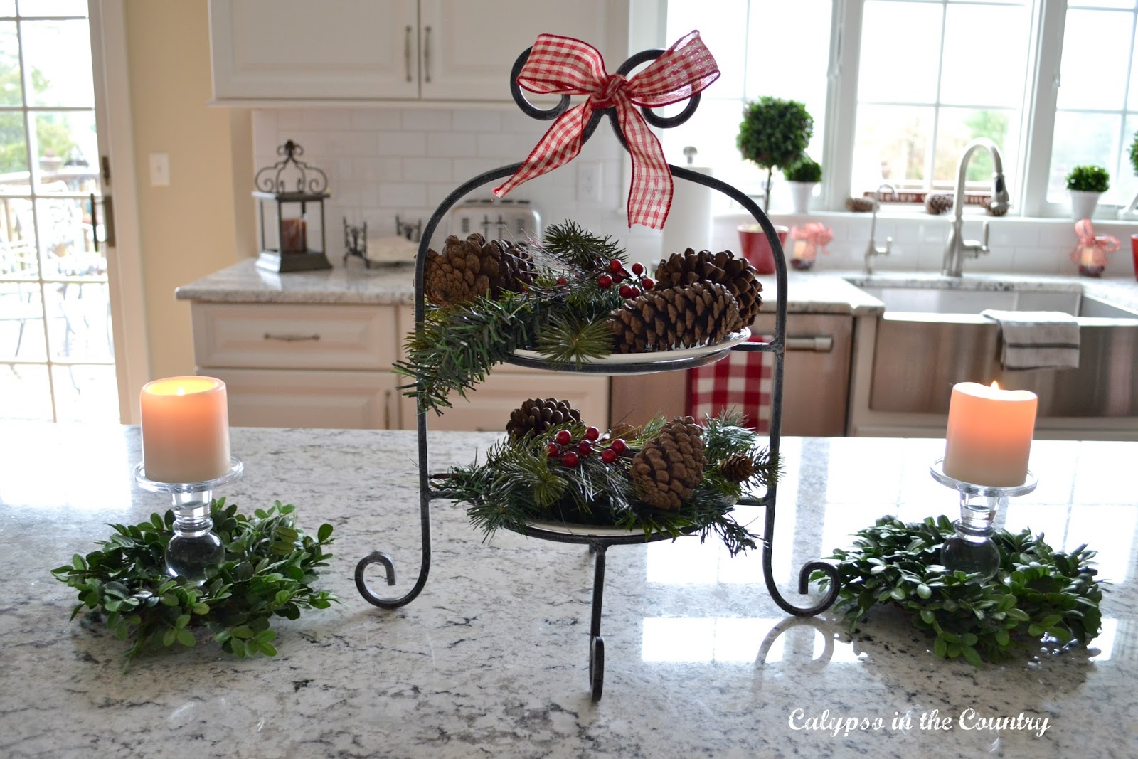 Christmas Vignette with tiered tray and pine cones