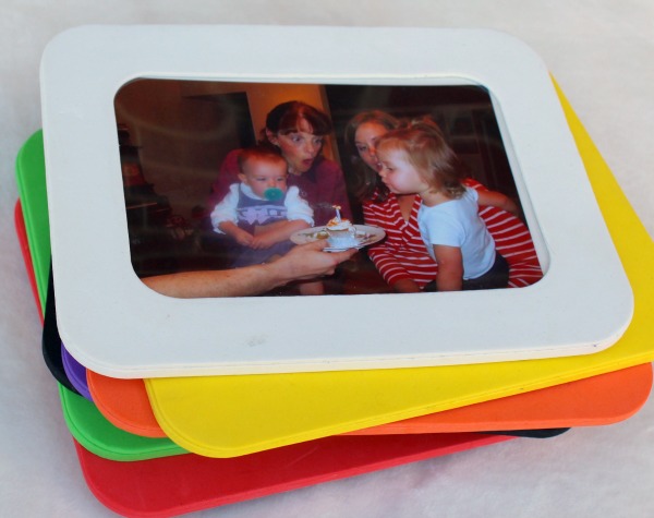 A creative and personalized gift idea for a one year old or a toddler- Family photos framed in colored foam. My toddler LOVES this!