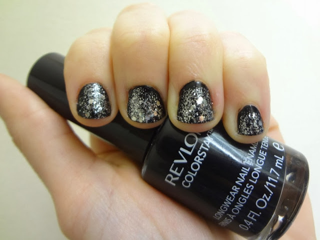 Black nail polish with silver glitter