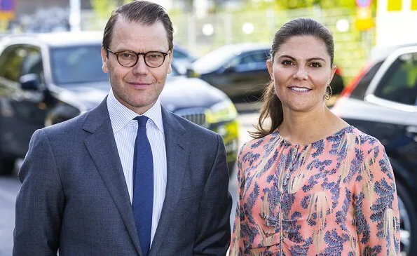 Crown Princess Victoria wore a printed floral silk dress from HM Conscious Exclusive collection, and Saint Laurent sandals. Quidam clutch