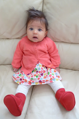 Baby girl wearing spotty dress