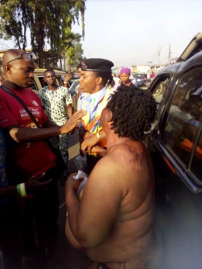 Image result for Mob strips female Kidnapper in Lagos