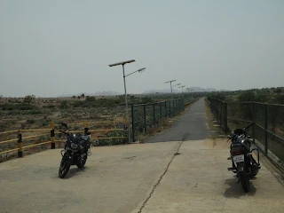 The group posing by a dried-up reservoir visited on the return journey