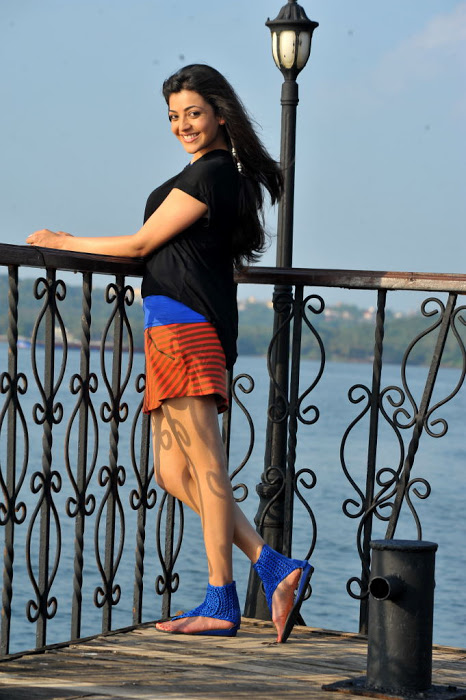 Kollywood Hot Actress Kajal Agarwal Legs Thighs Stills In Mini Black Dress