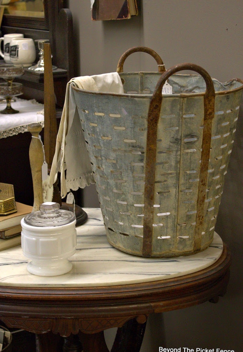 metal bucket, lace, antiques, how to decorate, Beyond The Picket Fence, http://bec4-beyondthepicketfence.blogspot.com/2015/02/5-decorating-lessons-from-store.html
