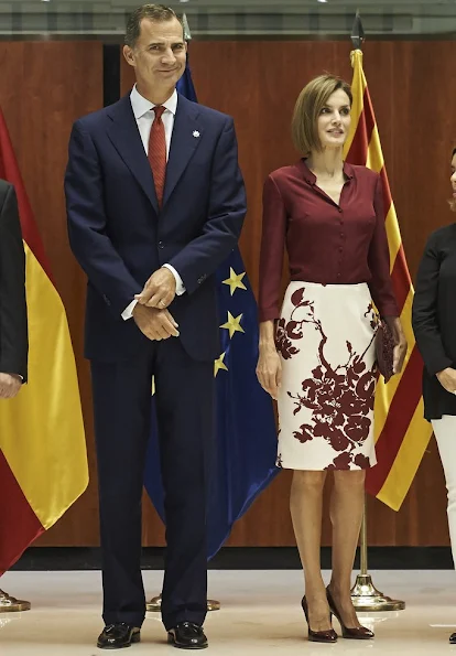 Queen Letizia attended an official lunch for Constitutional Tribunal. Felipe Varela satin blouse and floral skirt