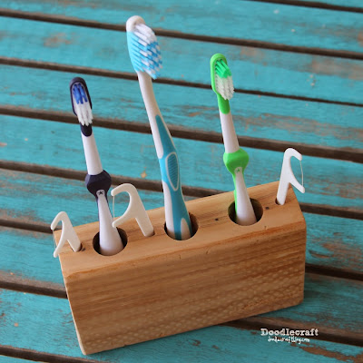 http://www.doodlecraftblog.com/2015/01/2-by-4-toothbrush-and-flosser-holder.html