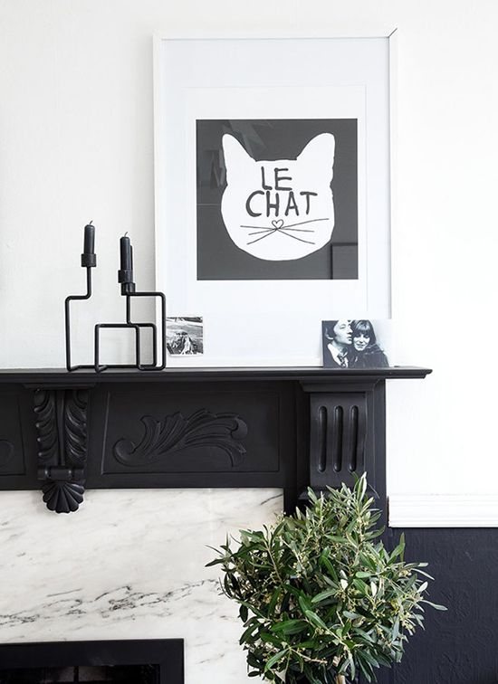 Impressive black and marble fireplace in Ollie and Seb's Haus photographed by Douglas Gibb