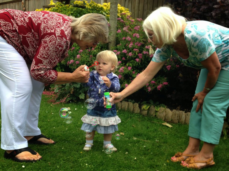 Tin Box Tot with her Grandmas and bubbles