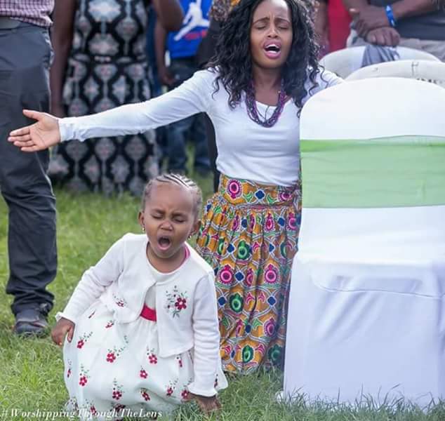 Viral photos of 3-year-old girl on her knees and in tears as she prays and worships God during a church service