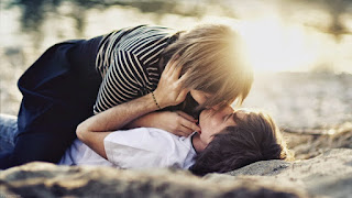 boy and girl in love kissing photo