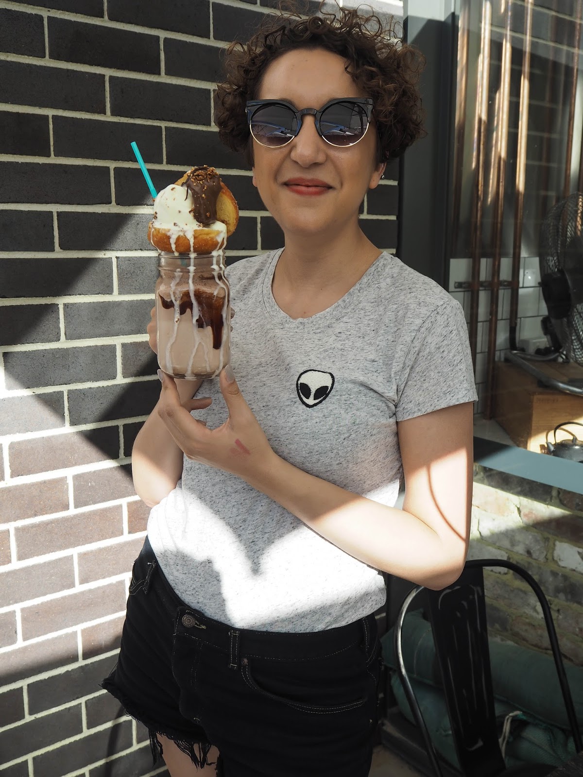 Woman with nutella and ice cream freakshake