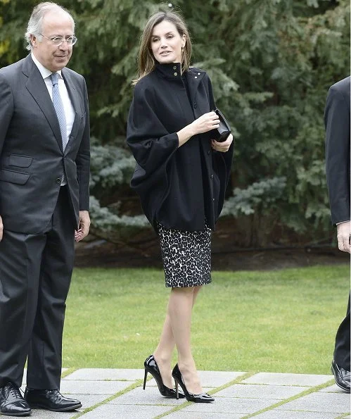 Queen Letizia wore Roberto Verino Jacquard pencil skirt and Hugo Boss Capina wool cape. Queen Letizia carried Nina Ricci Arc Clutch
