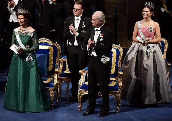 Queen Silvia, Prince Daniel, Prince Carl Philip. Princess Sofia wore a red dress. Crown Princess Victoria wore her mother's gown