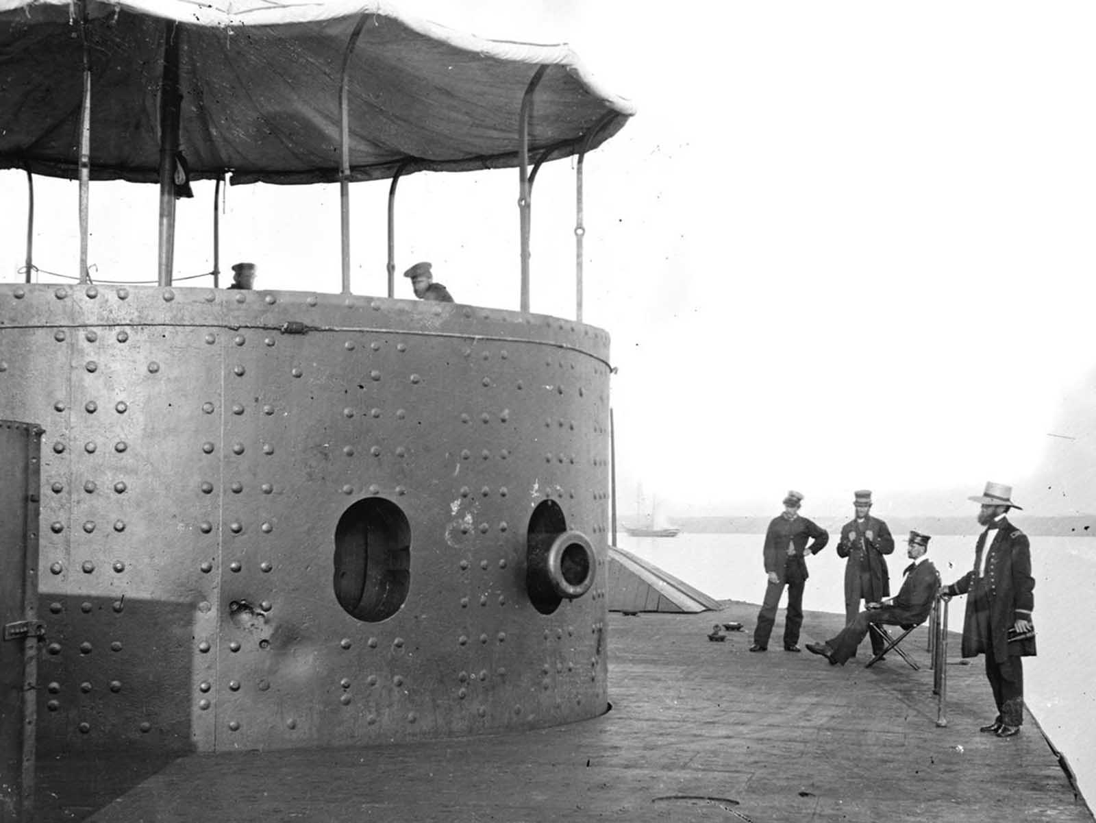 The deck and turret of the ironclad U.S.S. Monitor on the James River, Virginia, on July 9, 1862. the Monitor was the first ironclad warship commissioned by the U.S. Navy, and famously fought the Confederate ironclad CSS Virginia (built from the remnants of the USS Merrimack) in the Battle of Hampton Roads -- the first meeting in combat of ironclad warships -- on March 8-9, 1862. 