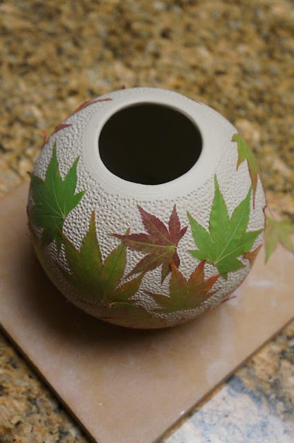 Beautiful unique leaf imprint ceramic pottery hand thrown vessel - in progress.