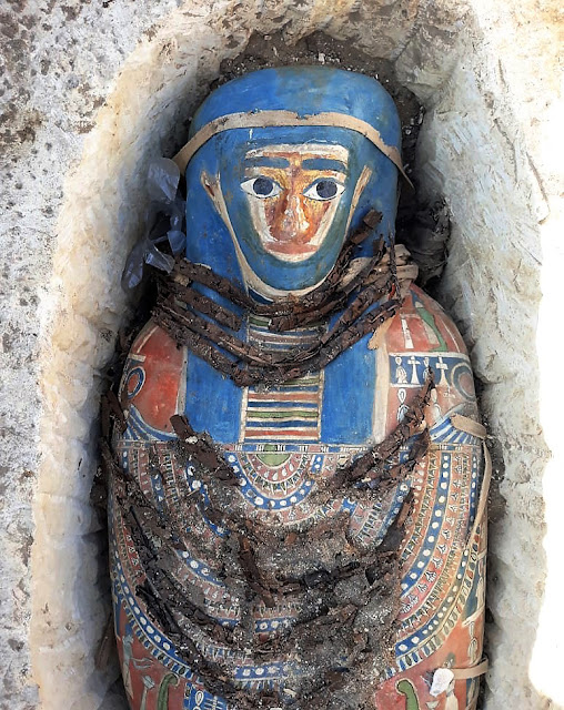 Eight limestone sarcophagi with mummies found near Giza's Great Pyramids