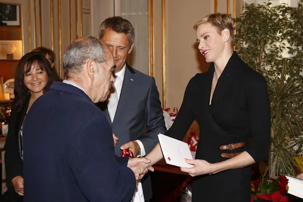 Prince Albert II of Monaco and Princess Charlene of Monaco attends parcels distribution at the Monaco Red Cross headquarters 