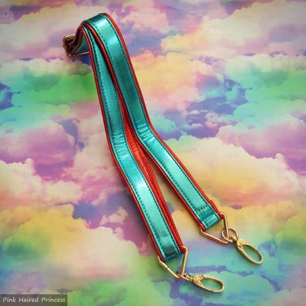 Irregular Choice Disney Fairest In The Land Bag long strap long metallic adjustable strap on rainbow cloud background