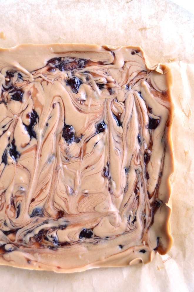Peanut Butter and Jelly Protein Fudge is rich and creamy, is no-bake, has 5 ingredients and is stored in your freezer for a healthier treat made with coconut oil and nut butter! www.nutritionistreviews.com