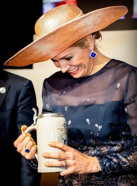 Queen Maxima wore a new embroidered dress by Natan Couture. The company is now officially named Royal Swinkels Family