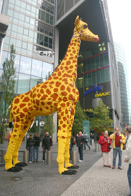 The SONY center with a lego giraffe sculpture.