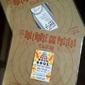 Detail of two dollhouse gig posters on their presentation cards.