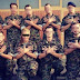 Swiss soldiers perform the two-headed eagle - the Albanian national symbol