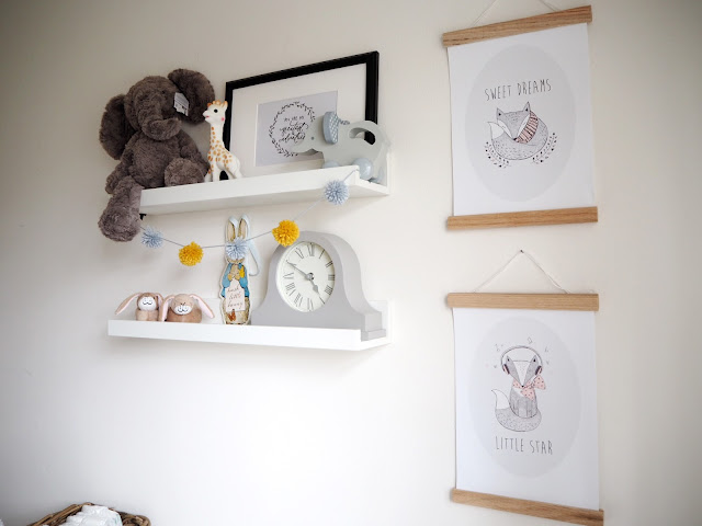 Gender neutral nursery room for a new baby boy or girl, in colour scheme grey and yellow featuring handmade accessories and interiors