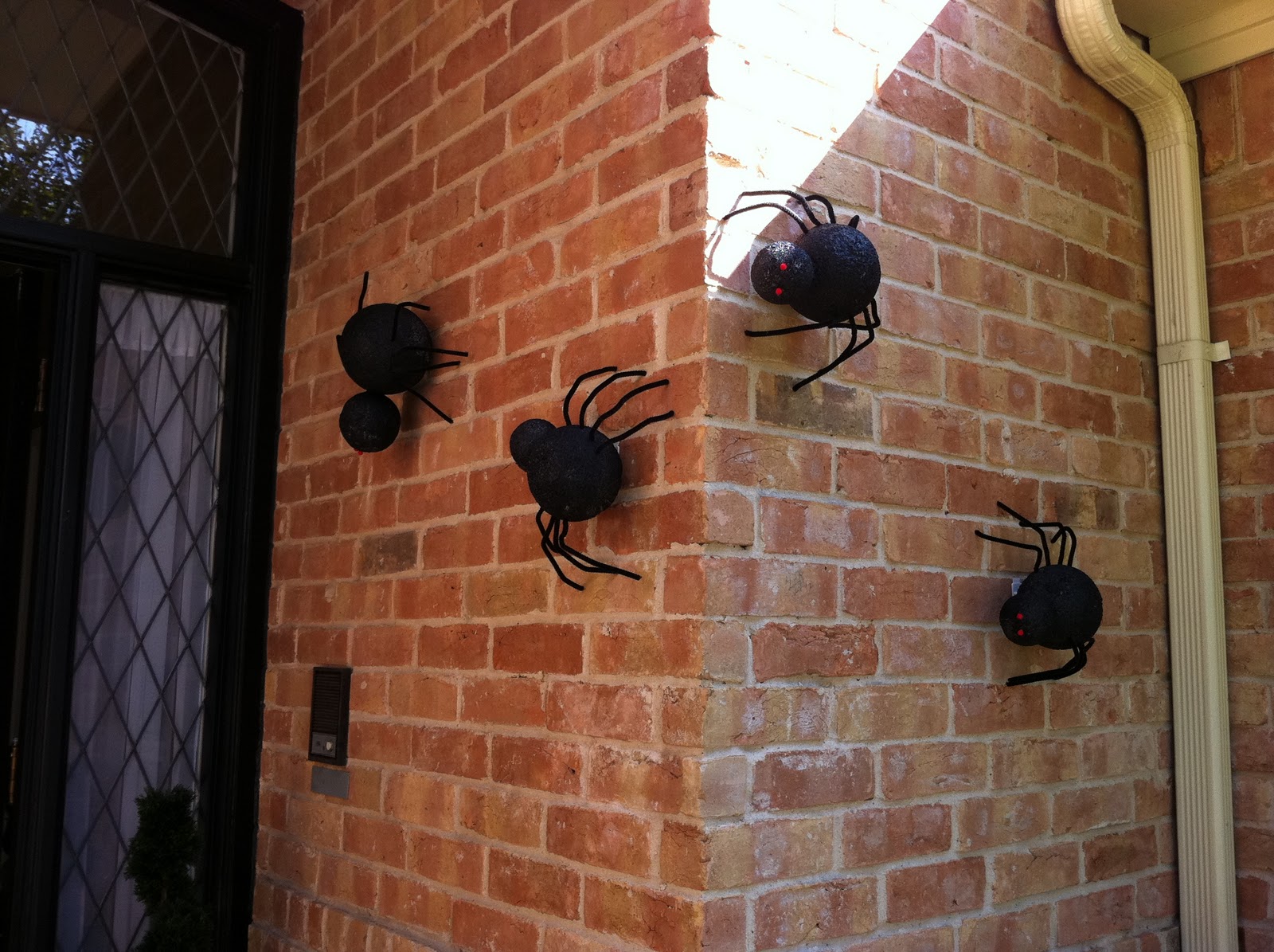 Want to get Crafty?: Repost: Halloween Outdoor Spiders How To Hang Spiders On Brick House