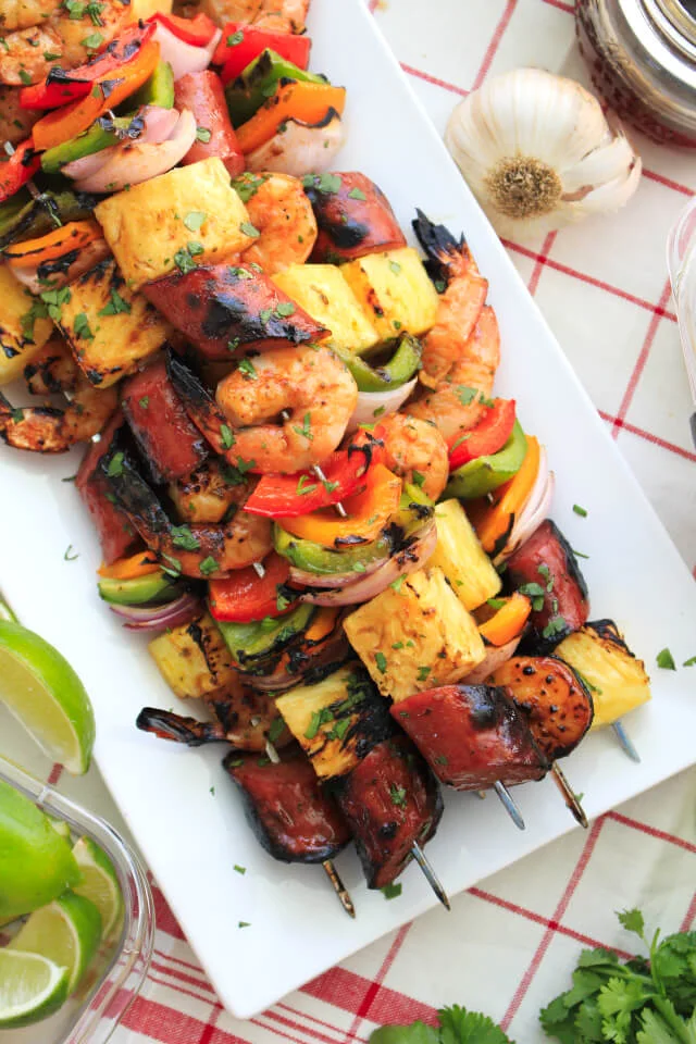 This Pineapple Shrimp and Kielbasa Kabobs recipe pairs tender marinated shrimp with lean turkey kielbasa and fresh vegetables for a colorful kabob that cooks on the grill in less than 10 minutes! #Ad  @Rubbermaid