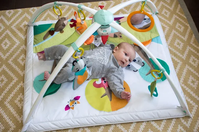 Tiny Love Gymini Deluxe Review with a baby on the play gym